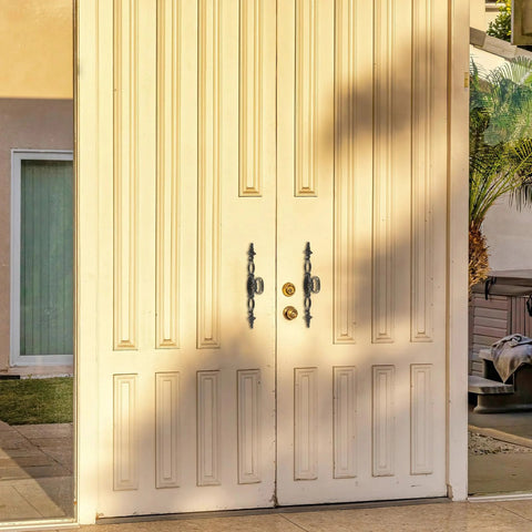 Front view of large double doors with Vintage Style Antique Bronze Long Cabinet Handles 6.3 inches, 2 pack hollow drawer pulls installed.
