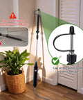Cordless Rechargeable High Reach Plant Waterer showing telescoping wand extended beside plant with focus on water outlet cap.