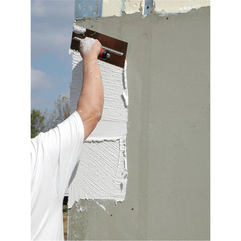 Worker using Finishing Trowel 20 By 5 Inch High Carbon Steel Blade With Curved Durasoft Handle And Xtralite Aluminum Mounting on wall