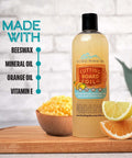 Cutting board oil bottle on wooden cutting board with lemon and orange slices; Blue Ridge Mountain Gifts label