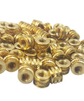 M3 0.5 Threaded Heat Set Inserts For 3D Printing Brass Threaded Inserts in a pile, gold color, visible tapered design and finned ridges