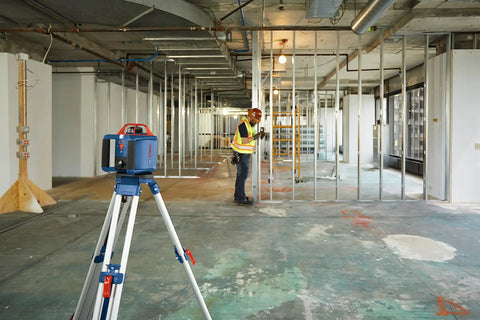 LR10 500 Ft Red Beam Rotary Laser Receiver Kit with Mounting Bracket in use on a construction site for precise leveling