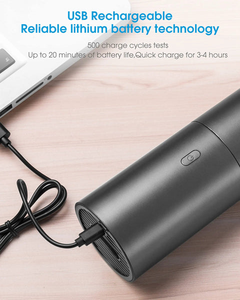Slick Cordless Mini Handheld Vacuum With Killer Two In One Suction And Air Blaster Mode charging via USB on a wooden surface.