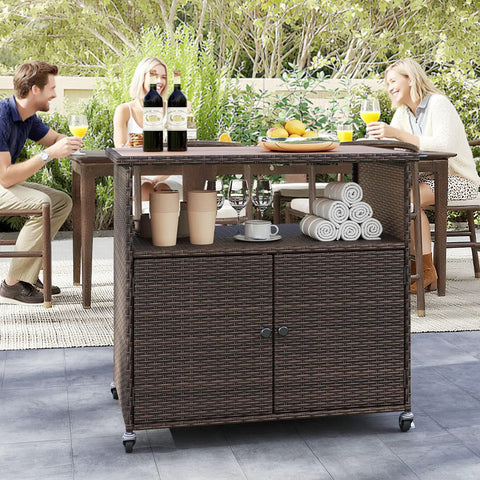 Sturdy outdoor storage cabinet on wheels with solid acacia wood frame and PE rattan finish, used as a patio buffet bar cart.