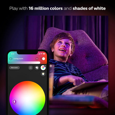 A boy enjoying the Get Your Hands On This Awesome A19 Smart Bulb That Gives You 16 Million Colors To Light Up Any Lamp Or Overhead Light Just Right Needs A Smart Hub To Work And Plays Nice With Alexa For Hands Free Voice Control This Is The Older Version But Still Kicks, with a colorful smartphone app interface.