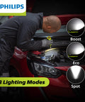 Mechanic using Slim Rechargeable LED Work Light With Magnetic Base And Hook on car engine, shows boost, eco, spot modes