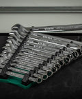 Person holding 13 Slot Reversible Wrench Rack Set Two Pack Holds SAE And Metric Wrenches Up To 1 Inch 25mm on table