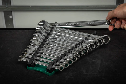Person holding 13 Slot Reversible Wrench Rack Set Two Pack Holds SAE And Metric Wrenches Up To 1 Inch 25mm on table