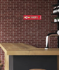 Official Kansas City Chiefs NFL Aluminum Metal Street Sign 4X15 Inch on a brick wall in a man cave.