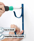 Installing 2 Pack Blue Pool Pole Hangers And Fence Hooks Beefy Built Heavy Duty Coated Steel on wall with included screws.