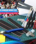 25-Piece Model Building Tools Kit for Hobbyists and DIY Enthusiasts with cutting, sanding, and engraving tools on work surface