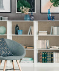 Bookshelf lined with taupe grasscloth wallpaper peel and stick 32 inch wide by 354 inch long roll self adhesive textured faux grasscloth contact paper for cabinets walls and furniture with easy install 78.46 sq ft coverage no mess removable, featuring books and decor items.