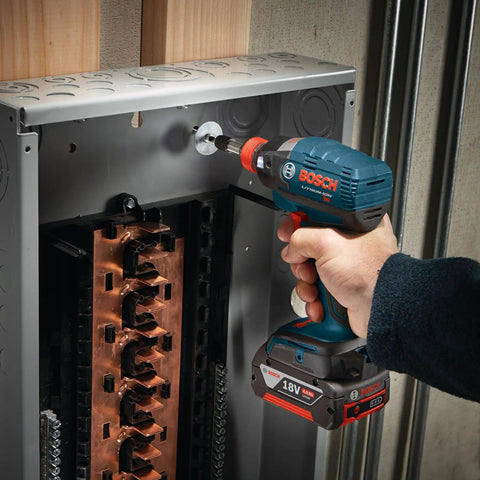 Hand using drill with Impact Tough Phillips Number Two 2 Inch Power Bits 5 Pack Xtended Torsion Zone for high torque drivers