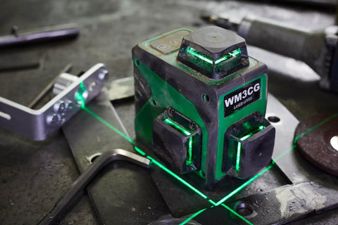 3x360 Rotary Laser Level With Green Beam Self Leveling One Horizontal And Two Vertical Planes 12 Line Layout in use on table