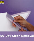 Delicate Surface Painter’s Tape For Fresh Paint Jobs 1.88 In Wide 60 Yd Rolls UV Resistant 60 Day Clean Removal being removed.