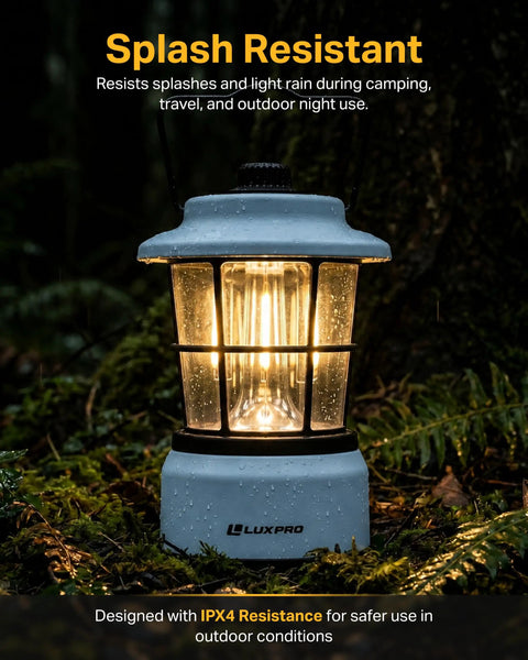 Retro LED Lantern For Outdoor Adventures And Emergencies in blue, lit up in a forest, displaying splash resistance.