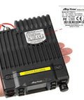 Hand holding Dual Band Mobile Transceiver 25W VHF UHF VOX Car Radio for Vehicle Use, Truck Ready Ham Radio, FCC compliant label visible