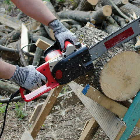 Person wearing Level 5 Cut Resistant Warehouse Work Gloves Crinkle Latex Coated Palm And Fingers with chainsaw cutting wood