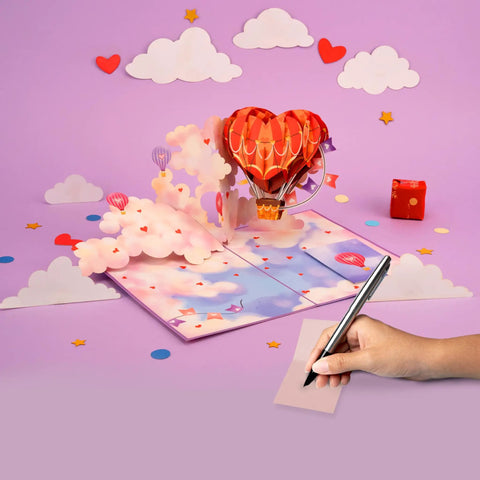 Heart Hot Air Balloon 3D Pop Up Card With Dreamy Sky Scene Gift For Valentines Day Birthday Mothers Day Anniversary Thinking Of You Includes Envelope And Message Note 5x7 Card, showing open card with clouds and pen on note