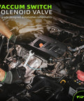 Mechanic installing Evap Purge Vacuum Solenoid Valve Replacement For Toyota Cars 136200-7350 994-116 CP808 in engine bay