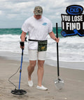 Man using Beach Metal Detecting Sand Scoop In Stainless Steel With Carbon Fiber Handle For Underwater Treasure Hunting on beach