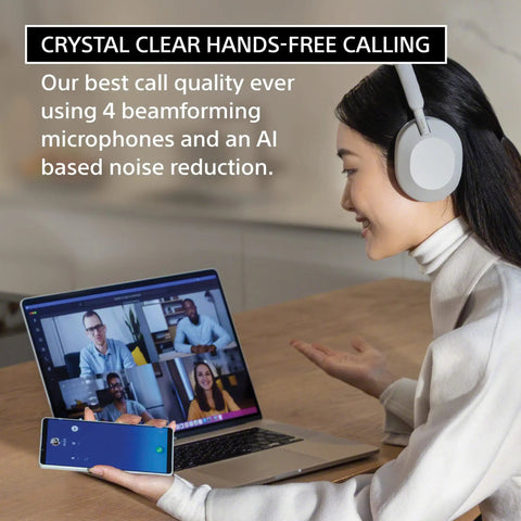 Woman using WH-1000XM5 Premium Noise Canceling Headphones With Auto NC Optimizer during video call on laptop.