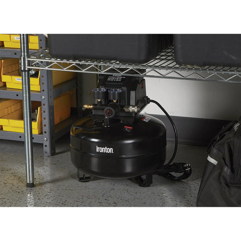 Portable 3 Gallon Air Compressor 0.3 HP 110 PSI Max Pressure Oil Free Pump under a shelf, black steel drum with handles.