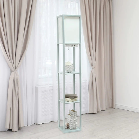 Gray Etagere Floor Lamp With 3 Shelves, 2 USB Ports, 1 Charging Outlet, Linen Shade, Soft Warm Glow standing in a living room.