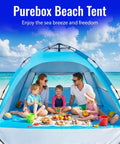 Family enjoying a picnic inside Easy Setup Beach Tent Sun Shelter For Family Beach Day Ideal 4 To 5 Person Shade With UV 50 Plus Protection.