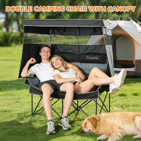 Couple seated on Double Camping Chair With Adjustable Canopy Shade Heavy Duty Two Person Folding Loveseat at campsite.