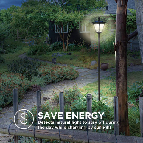Sun Powered Outdoor Solar Lamp Post Light 65 Inch Tall Black Garden Decor With Warm LED No Wiring Easy Setup Durable Pathway Post Light For Yard Patio at night, illuminating garden path.