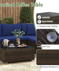 Tempered glass coffee table of 7 Piece Outdoor Wicker Patio Furniture Set for Six With Cushions, Mix Brown and Navy