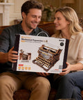Typewriter 3D Wooden Puzzle Kit For Adults Mechanical Model Build No Batteries Gears Spin Typebars Swinging Knobs See Inside Vintage Black Style Desk Display Gift That Slaps box held by couple on sofa