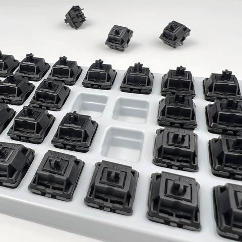 Oil King V2 Pre-Lubed Black Linear Keyboard Switches Pack Of 10 displayed in a tray