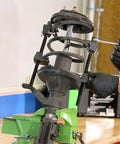 Mechanic using MacPherson Strut Spring Compressor Kit Two Pack With 10.75 Inch Opening Universal Automotive Tool on strut