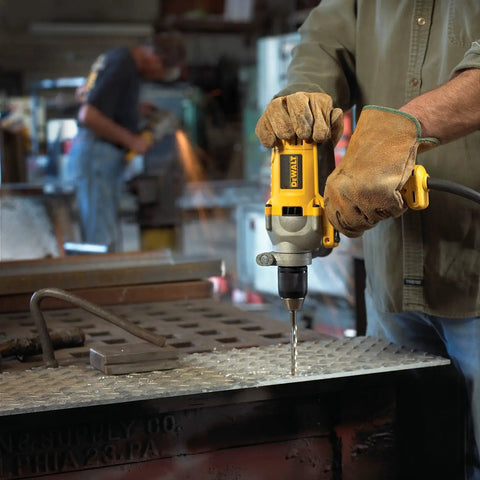 Worker using Corded Drill Powerhouse with 1/2-Inch Chuck, 10 Amp Motor, Mid Handle Grip for heavy-duty drilling on metal surface.