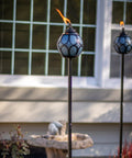 Two Pack Metal And Glass Globe Outdoor Torch Set For Patio And Yard Easy Install 64 Inch Tall Blue And Black With Wick And Snuffer