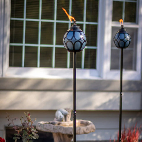 Two Pack Metal And Glass Globe Outdoor Torch Set For Patio And Yard Easy Install 64 Inch Tall Blue And Black With Wick And Snuffer