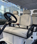 Interior view of Smooth 48V Lithium Golf Cart Sightseeing Patrol Rig with premium headrest seats and steering wheel.