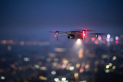 Mavic 2 Pro Drone Quadcopter With Hasselblad Camera, 3 Axis Gimbal, HDR 4K Video, Adjustable Aperture flying over city at night