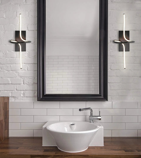 Nine Inch Black Sleek Modern Minimalist Integrated LED Vanity Light Sconce flanking a bathroom mirror with a dimmable feature