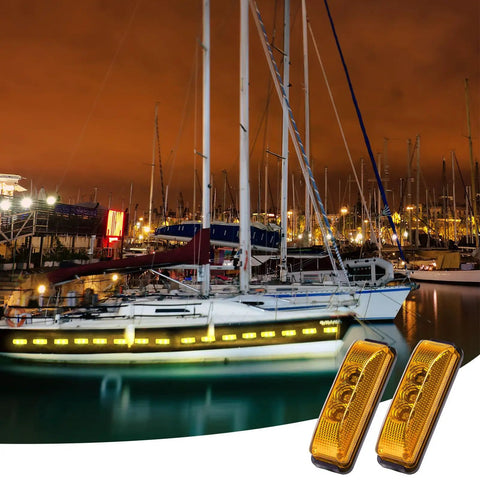 20 Pcs 3.9 Inch 3 LED Amber Trailer Marker Lights Waterproof Side Marker Light Rectangle Signal Running Lights for Truck Boat RV Exterior Accessories with 40 Screws for Easy Install shown on a boat at night