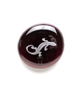 Dark glass stone with a lizard image from Geocache Swag Glass Stones Set Of Six With Fun Images In A Deluxe Gift Box.