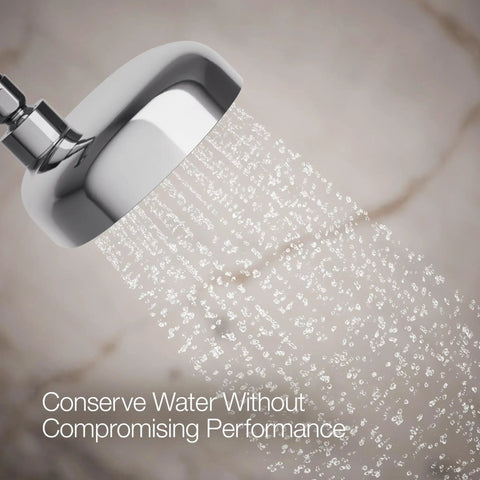 Statement Three Function Showerhead With Katalyst Air Induction in polished chrome spraying water in bathroom setting.