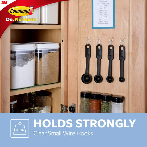 Damage Free Hanging Wall Hooks For Small Decor Clear Wire Toggle Hooks With Adhesive Strips shown holding measuring spoons