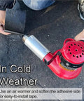 Person using hairdryer to heat Heavy Duty Self Adhesive Crack Sealing Tape For Driveways And Pavements for installation.