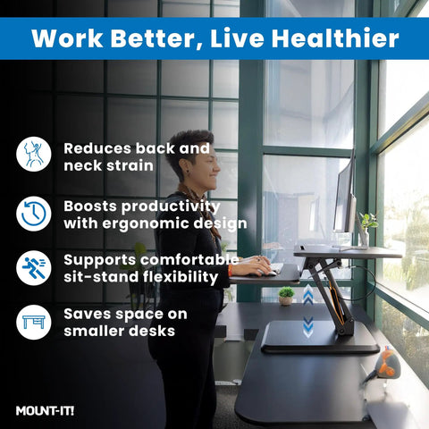 Compact 25 Inch Standing Desk Converter Sit Stand Desk Riser With Gas Spring Lift in small office environment with person using it.