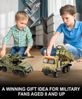 Children playing with Military Vehicle Building Kit Dual M142 HIMARS And Dana M2 Howitzer Army Truck Models on wooden floor.