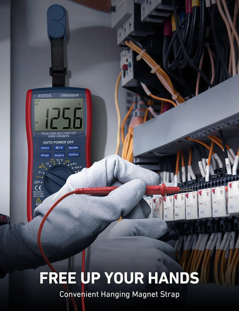 Engineer using Digital Multimeter And Analyzer With TRMS 6000 Counts Auto Ranging Pro Grade in electrical panel.