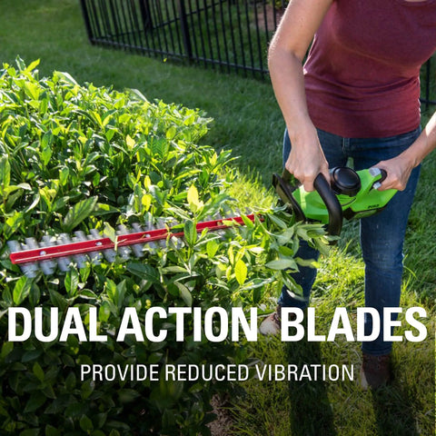 Person using 24V Cordless 22 Inch Laser Cut Hedge Trimmer Tool Only With Dual Action Steel Blades on green hedge